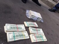 На взятке в полмиллиона долларов поймали члена ВСЮ